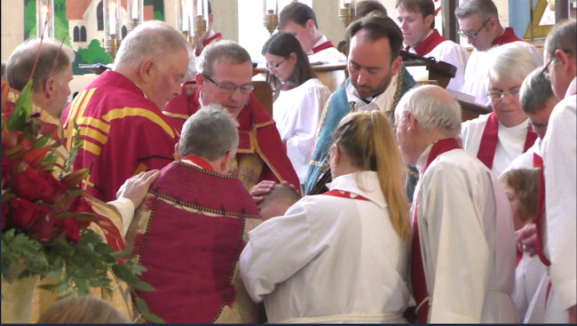  f-The Bishop and Assisting Priests lay hands on the candidate during the Ordination.jpg 